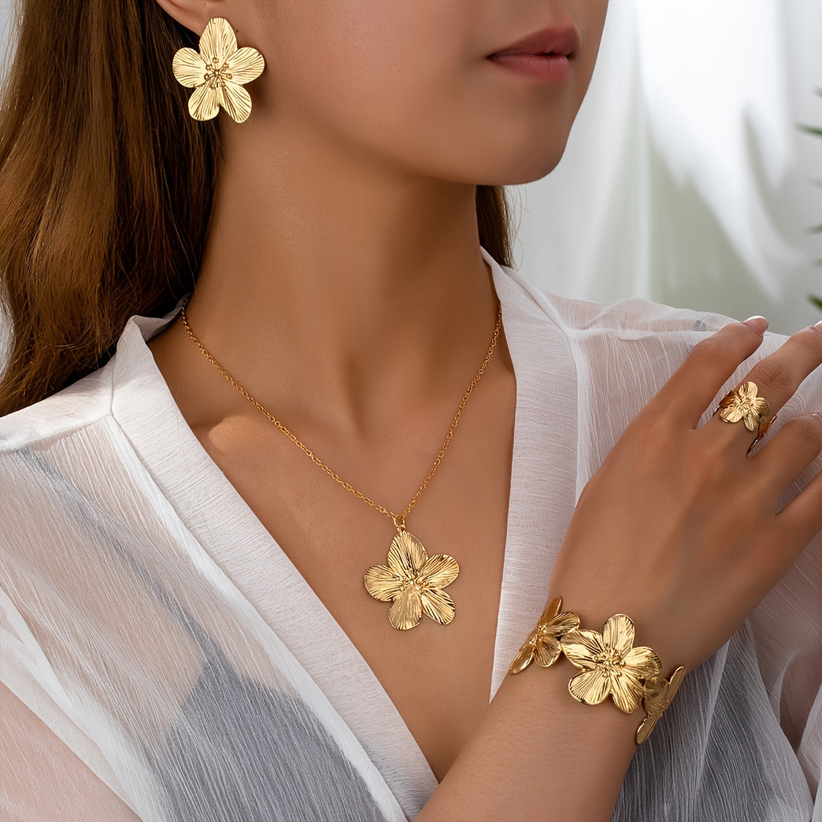 Set of 5 stylish and beautiful floral jewelry pieces including earrings, rings, bracelets, and necklaces.