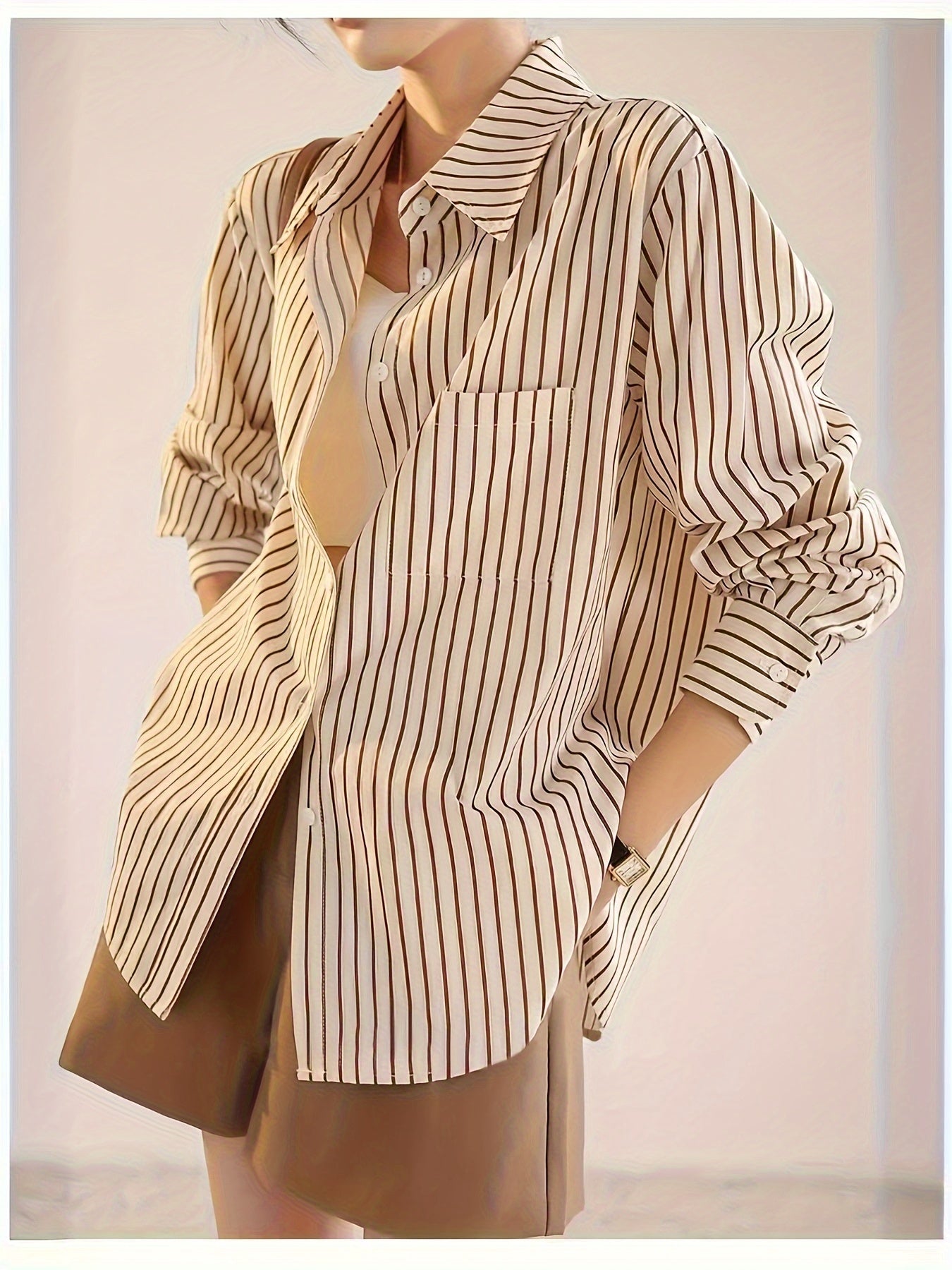 Elegant striped button-up shirt for women with a French-inspired design in beige and brown vertical stripes for spring/summer.