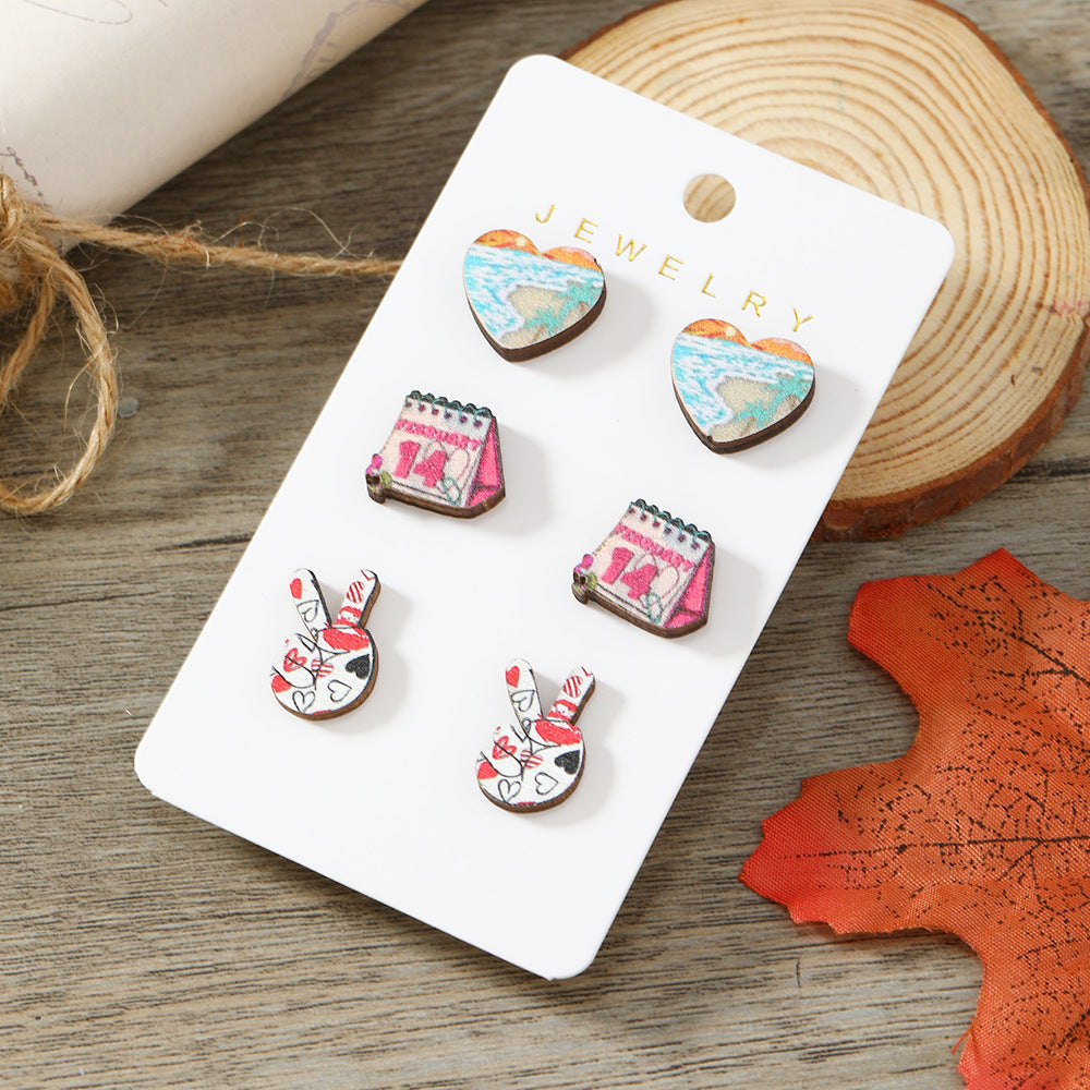 Get 9 pairs of women's fashion earrings for Valentine's Day, including pink rose love earrings, wooden cupid's arrow calendar earrings, coffee cup love earrings, palm bier earrings, and more. These earrings are made from wooden materials and will make