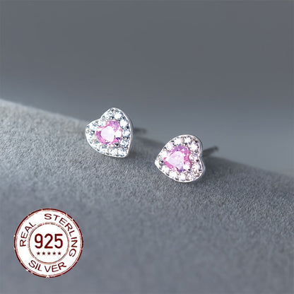 These stylish and versatile earrings are crafted from S925 sterling silver and feature sparkling zirconia in a heart-shaped design. Perfect for daily wear, gifting, or vacation, they have a silvery weight of 0.7-0.5g.