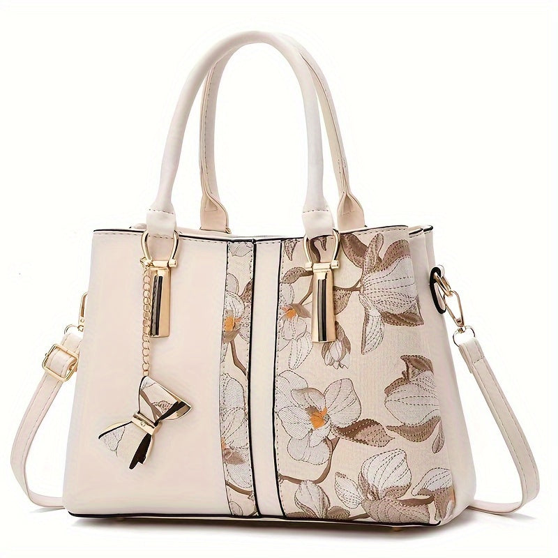 Chic floral print handbag with a spacious crossbody design.