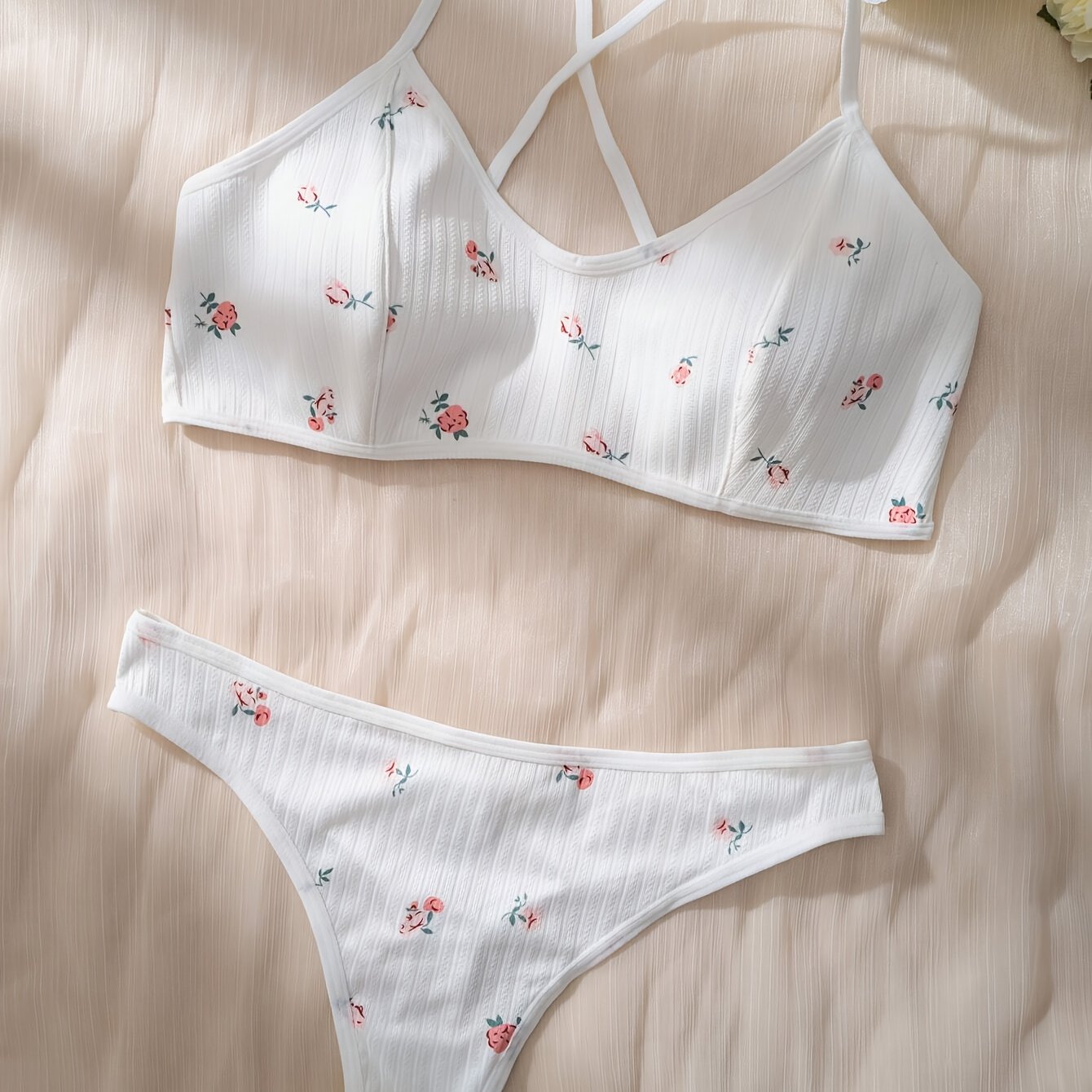 Stylish floral print lingerie set with cross straps, for women.