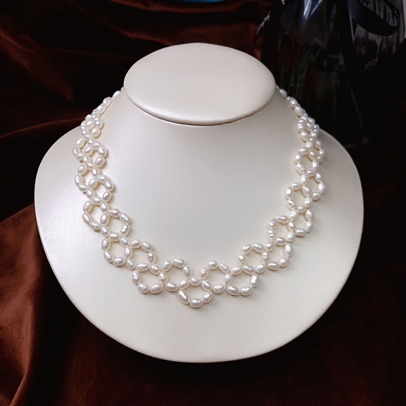 Elevate your style at parties, holidays, and special occasions with this exquisite, handcrafted clavicle chain inspired by delicate French vintage designs. This luxurious freshwater pearl necklace is sure to add a touch of elegance to any outfit.