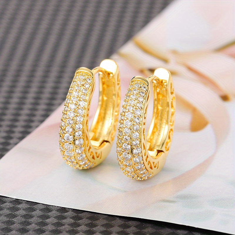 Vintage-style golden hoop earrings with sparking zirconia inlays, crafted from copper material, make a sophisticated and elegant gift for women.