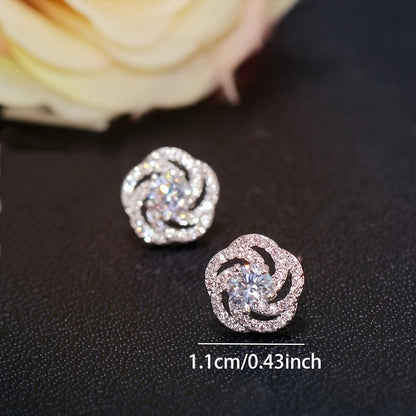 These dainty zirconia stud earrings are crafted from high-quality 925 sterling silver in a charming rose shape. Lightweight at approximately 2.1 grams, these versatile and lovely ear accessories are perfect for everyday wear.