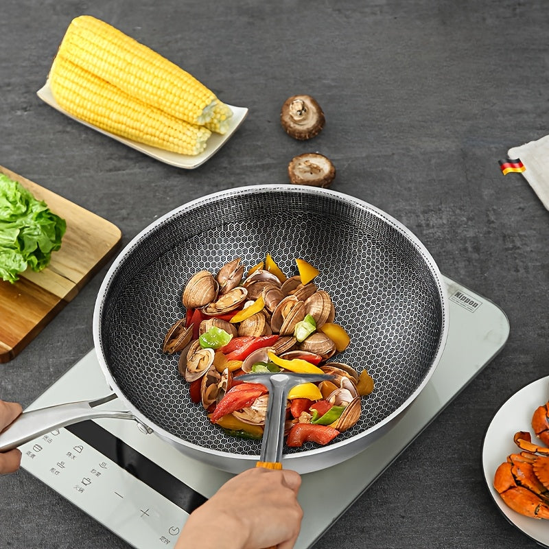 A must-have for home cooking, this high-quality stainless steel wok features a unique honeycomb design that is uncoated and non-stick. Perfect for use on gas stoves, induction cookers, and more, this versatile wok is lightweight and ensures a minimal