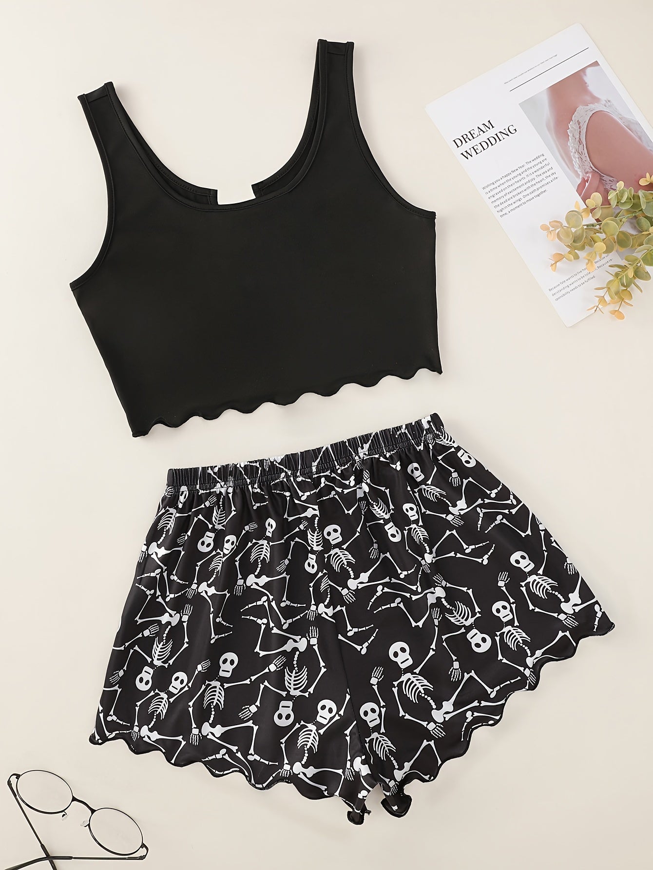 Skull print pajama set with lettuce trim tank top and shorts for women's loungewear and sleepwear at a music festival.