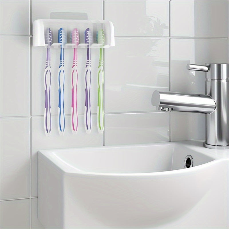 Wall-mounted toothbrush and toothpaste holder that saves space, requires no punching for installation, and is easy to install in the bathroom.