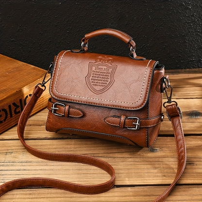 Old-fashioned handbag with embossed letter badge, stylish crossbody satchel for women.