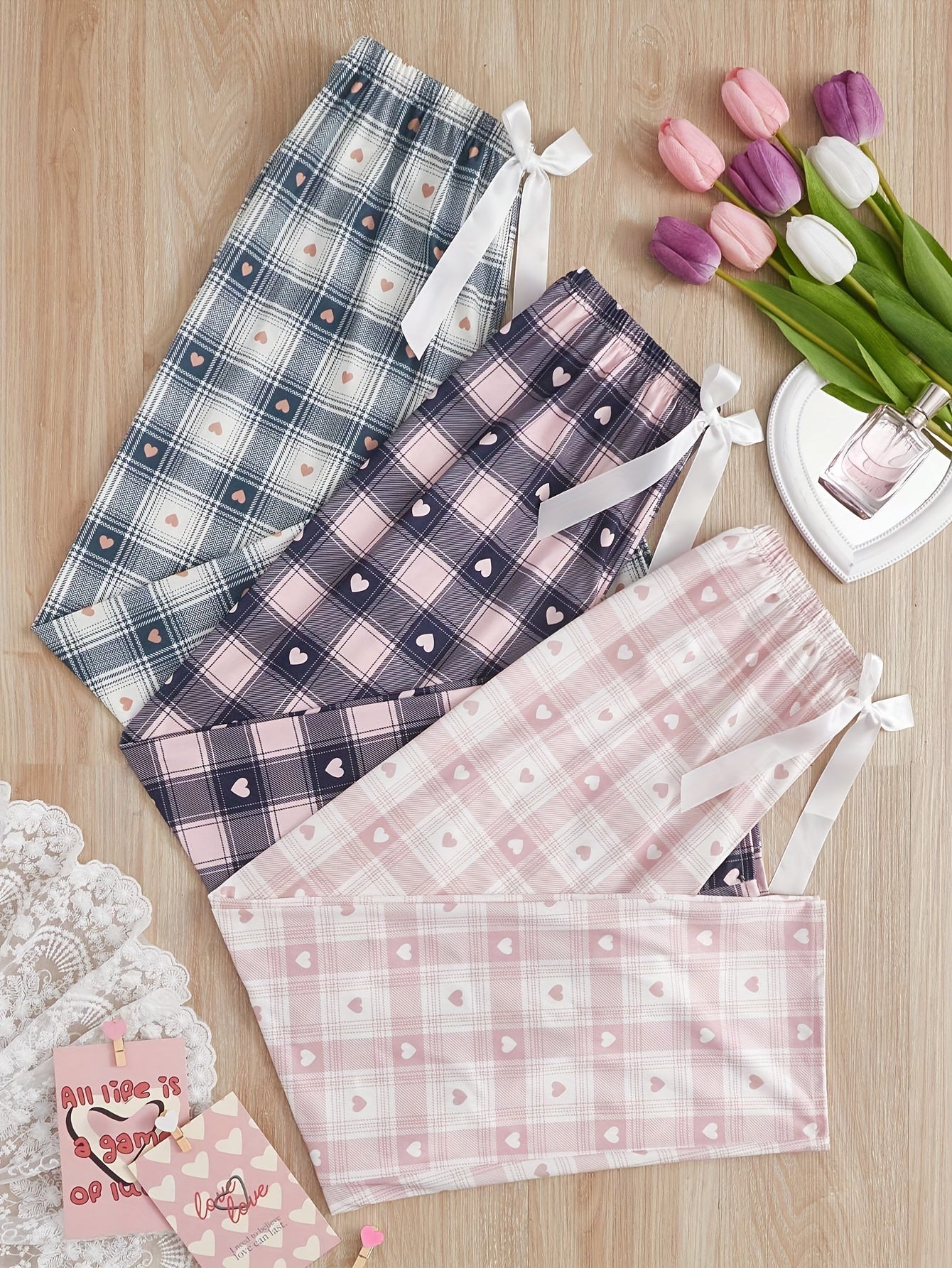 New arrival 3-pack women's printed plaid sleep pants for all seasons. Made of polyester with a front tie bow detail, perfect for summer and autumn home wear. Adult size, no belt included.