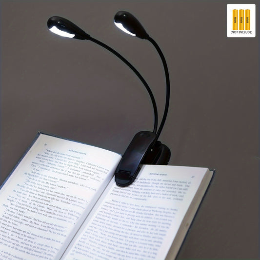 Adjustable clip-on reading light with 4 LEDs for night readers. Portable, battery-powered desk lamp in sleek black design, ideal for travel and bedroom use.