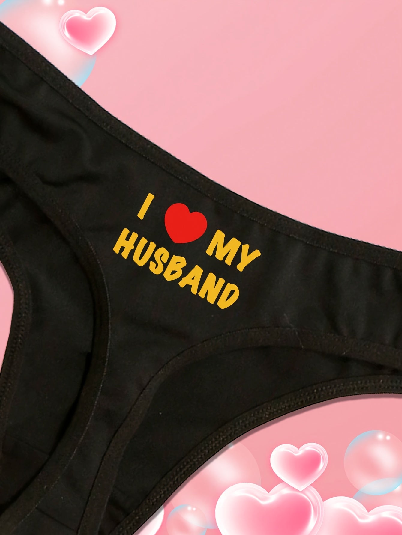 Novelty thong panties with "I Love My Husband" print for Valentine's Day and Father's Day. Sexy low-rise triangle underwear in polyester, casual style. Adult size, knit fabric, 1-pack.