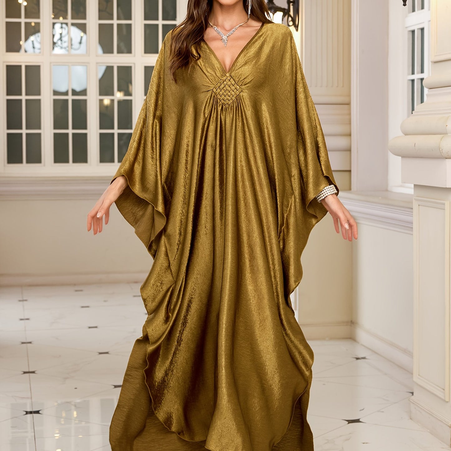 Stylish olive green V-neck kaftan dress with bat sleeves. Ideal as a beach cover-up or casual outerwear for women. Offers sun protection and a loose fit, perfect for spring/summer/fall