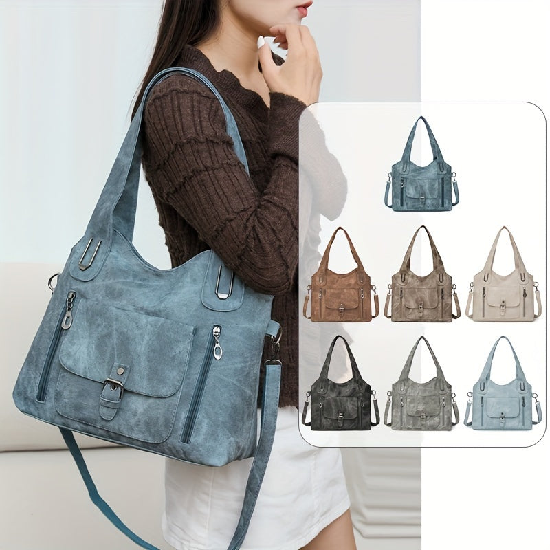 Retro women's shoulder tote bag with soft synthetic leather, adjustable strap, zipper closure, multiple pockets, and polyester lining in light blue/blue/black. Suitable for daily use or