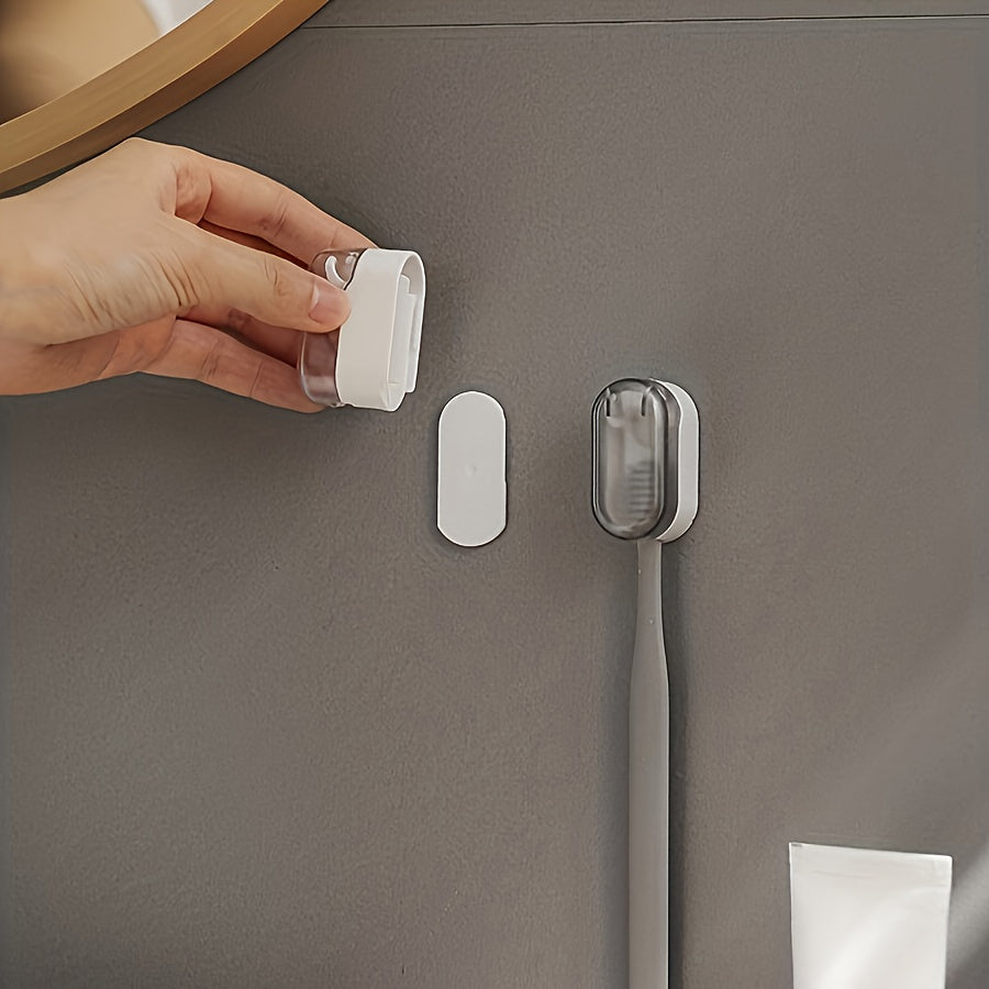 Wall-mounted toothbrush holder with cover, suitable for bathroom storage and decoration.