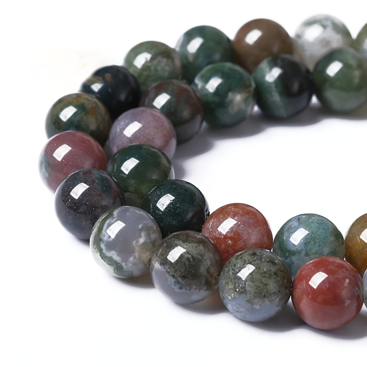 Indian Agate Round Loose Spacer Beads available in natural stone, perfect for DIY bracelet making. Each strand measures 15 inches in length with bead sizes of 4, 6, 8, 10, and 12mm. Ideal for creating unique jewelry accessories.