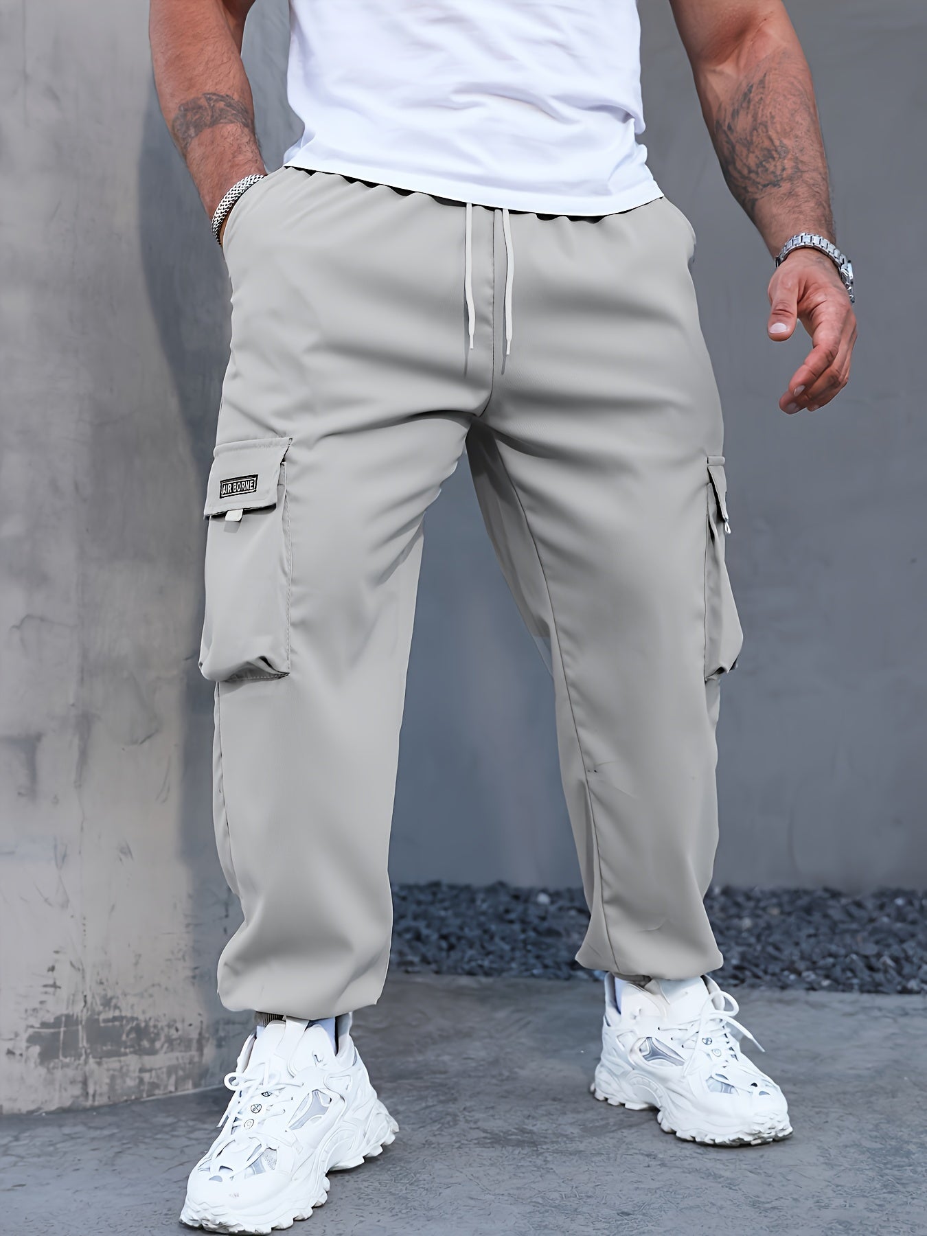 Japanese men's casual work pants with multiple pockets and loose, tied feet for spring 2023