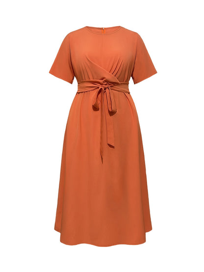 Stylish women's summer dress with bow tie waist, round neck, and short sleeves. Made of lightweight polyester, machine washable. Ideal for casual or formal events.