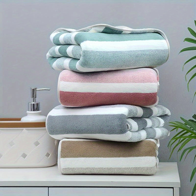 Set of 2 luxurious soft touch bath towels with stripes, highly absorbent and quick-drying for ultimate comfort, suitable for home decor and spa use.