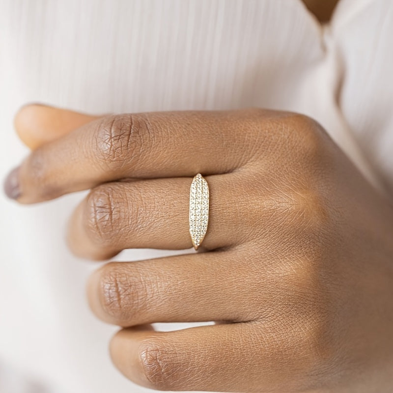 This exquisite ring is made of 925 sterling silver and is elegantly plated with 14k gold. It is adorned with sparkling zirconia stones, representing luxury and sophistication. This high-quality ring is perfect for engagements or weddings, embodying