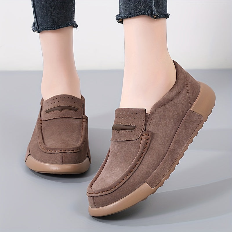 Women's slip-on loafers in solid color with round toe, casual low-top design.