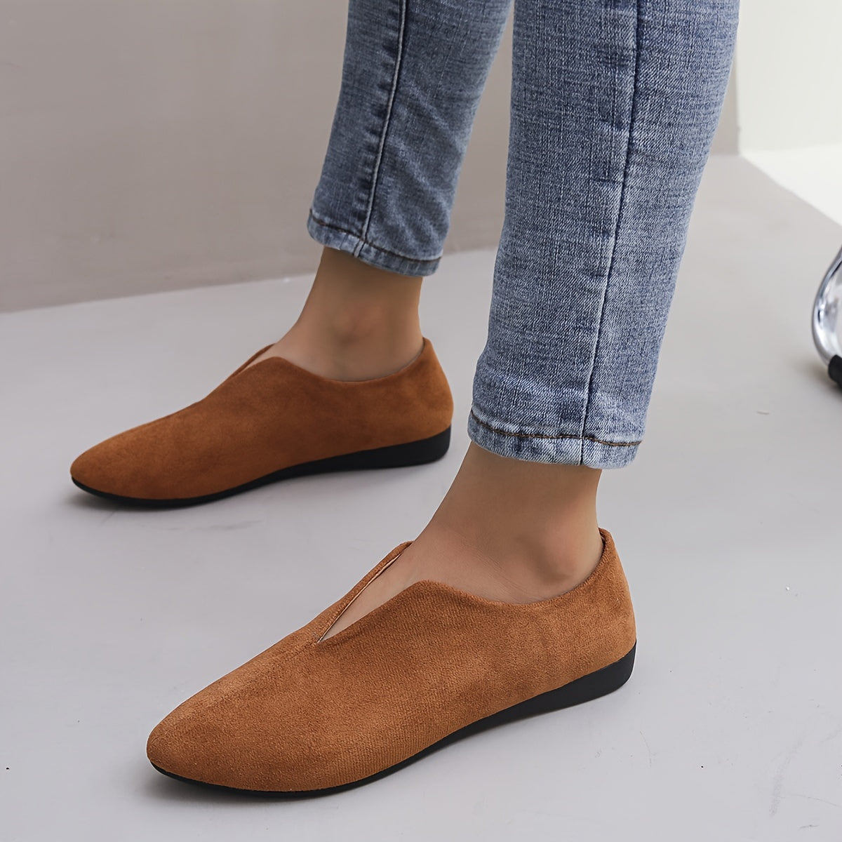 Women's solid color casual flats with a soft sole and point toe.