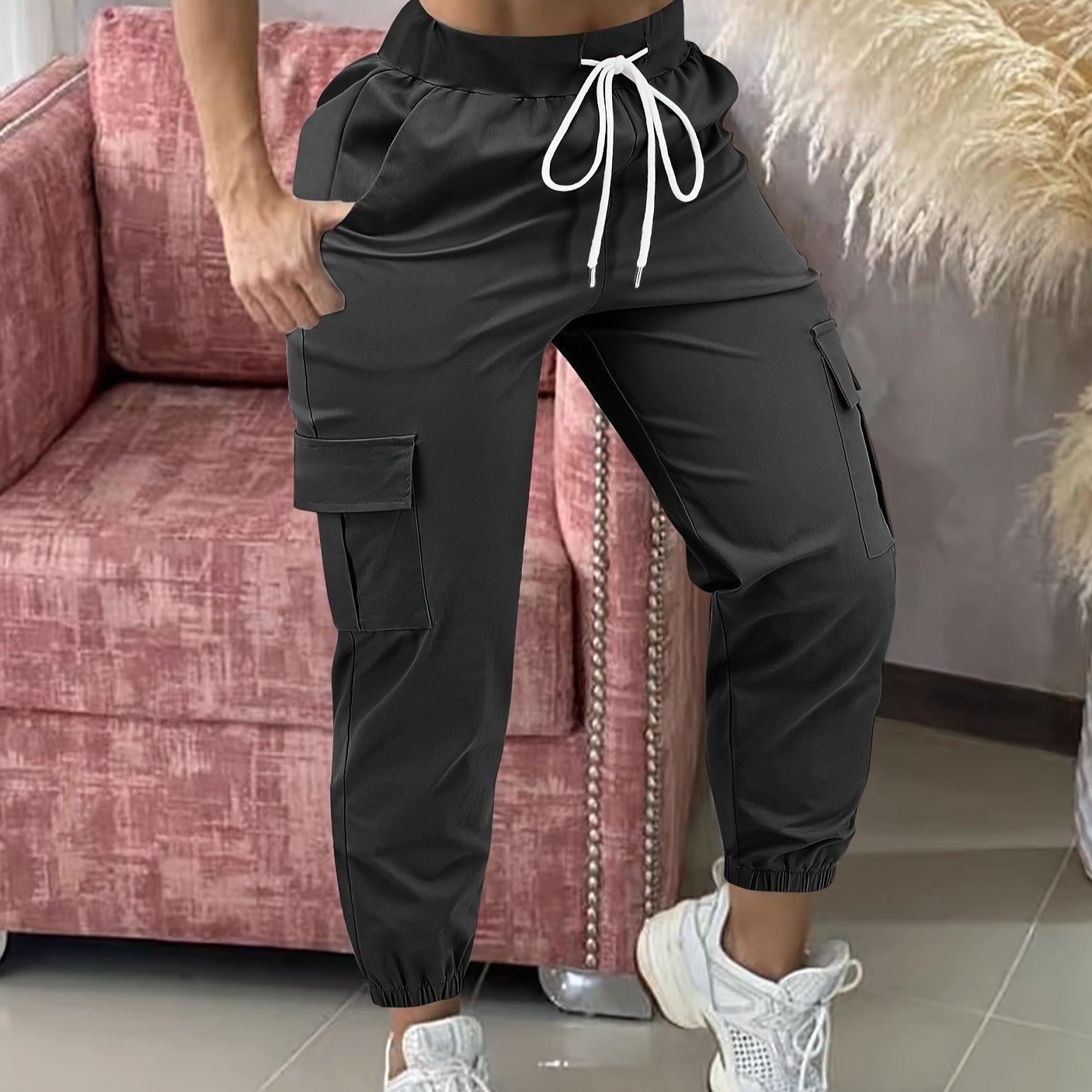 Women's casual cargo pants made of polyester with a drawstring waist.