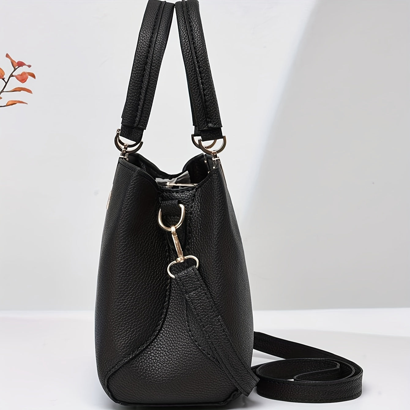 Stylish shoulder bag with bowknot detail and multiple compartments, perfect for work, parties, and everyday use.