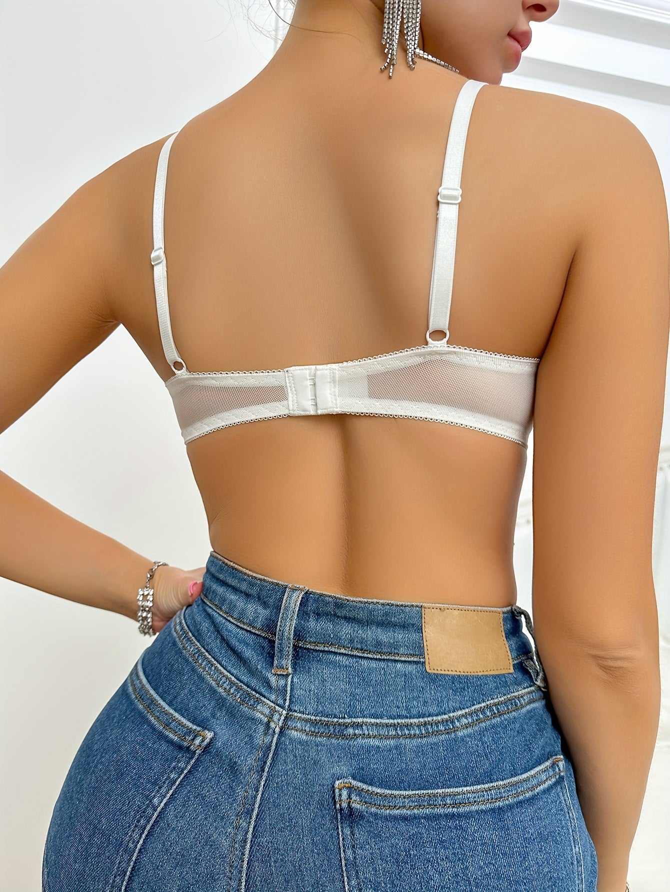 Women's sexy clothing - backless bra with thin shoulder straps and charming design.