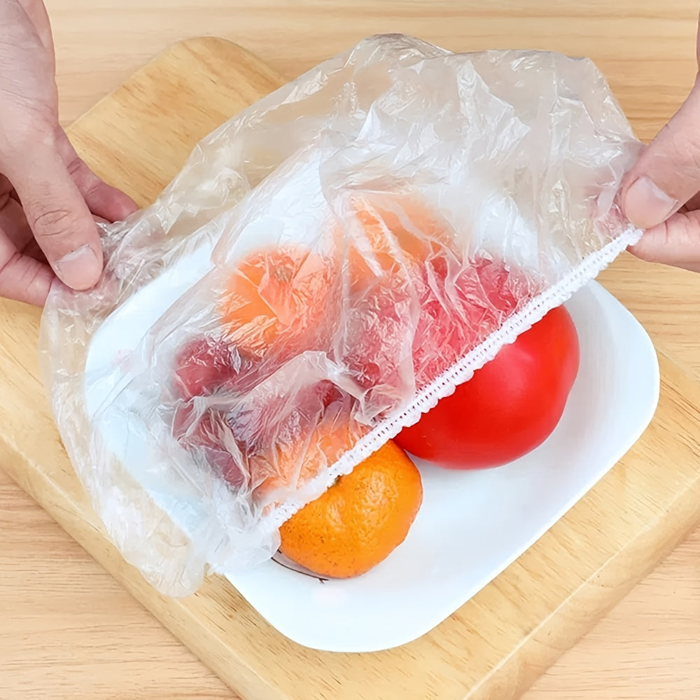 50-100 pieces of disposable fresh-keeping covers made of plastic for use in storing food. These covers are elastic and can be used to cover various storage containers in the kitchen or outdoors during picnics and camping trips.