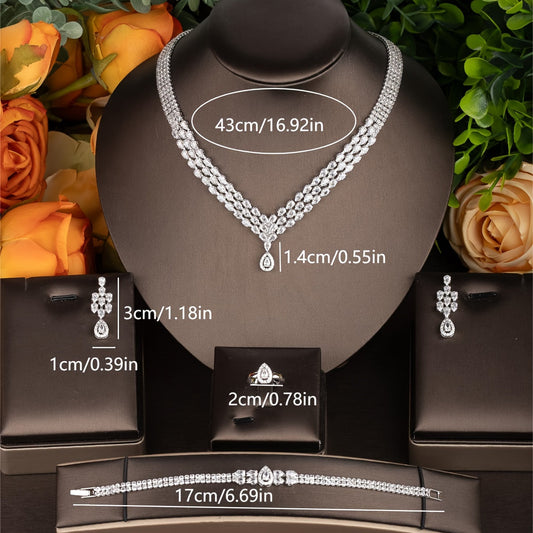 Beautiful cubic zirconia teardrop jewelry set including necklace, bracelet, earrings, and ring, perfect for women to wear on their wedding day.