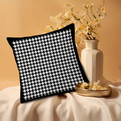 This reversible Contemporary Houndstooth Throw Pillow Cover measures 44.96cm and features a zipper closure. Made of woven polyester, this machine washable cushion case is perfect for living room decor. The black and white design adds a modern touch and