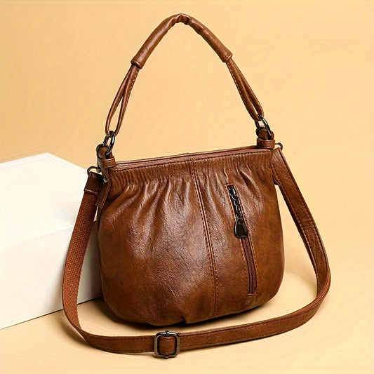 Vintage women's fashion bucket bag with zipper closure, polyester lined and solid color in black/dark brown.