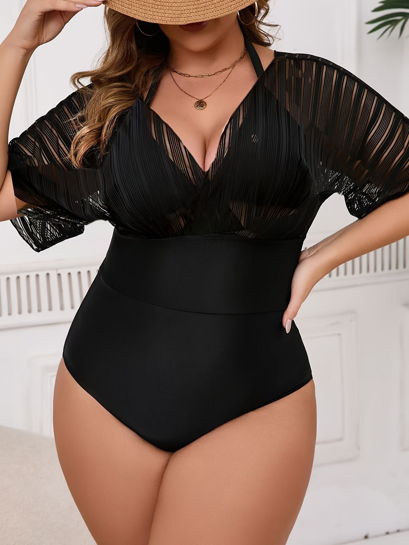 Stylish plus size women's one-piece swimsuit with matching cover-up. Features V-neck, high stretch, removable pads, machine washable.