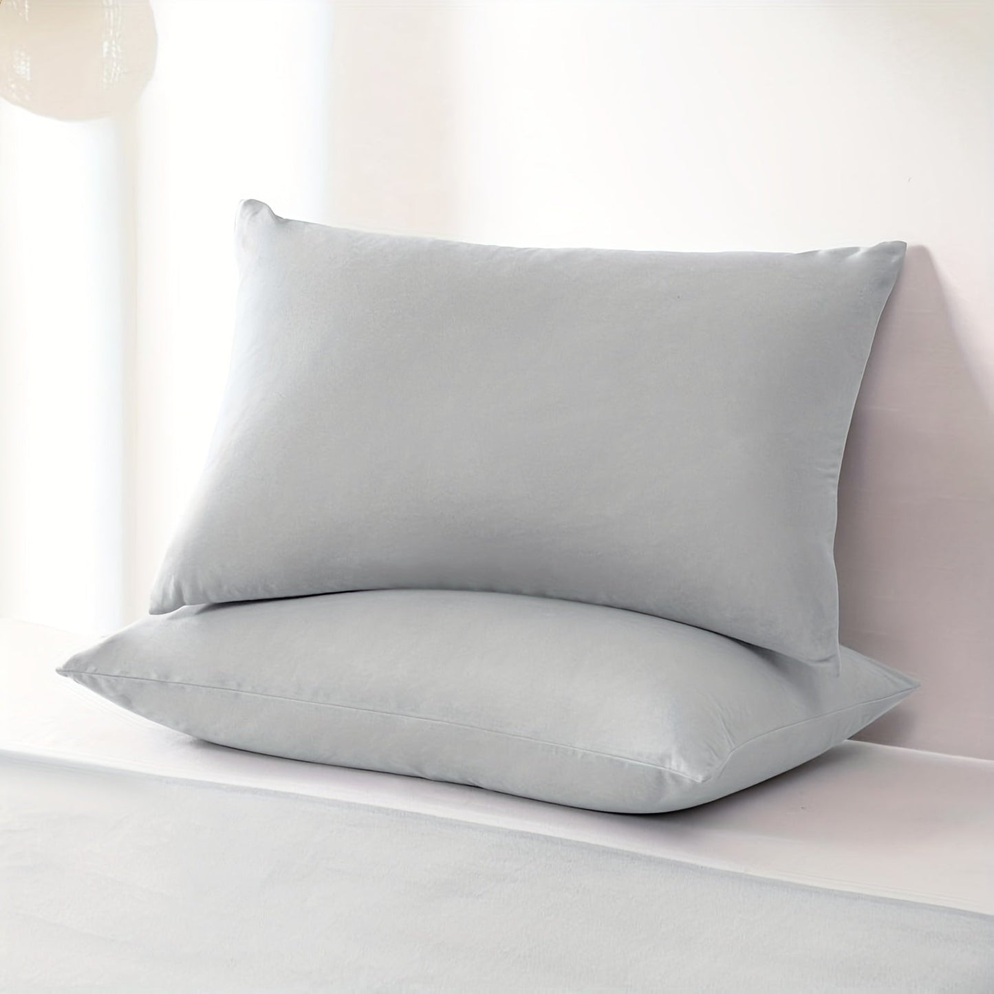 Water-resistant Grey Universal Pillow Protector Cover made from durable, stain-resistant 100% polyester fabric. Machine washable and suitable for home, hotel, or dorm use. Weighing 105gsm.