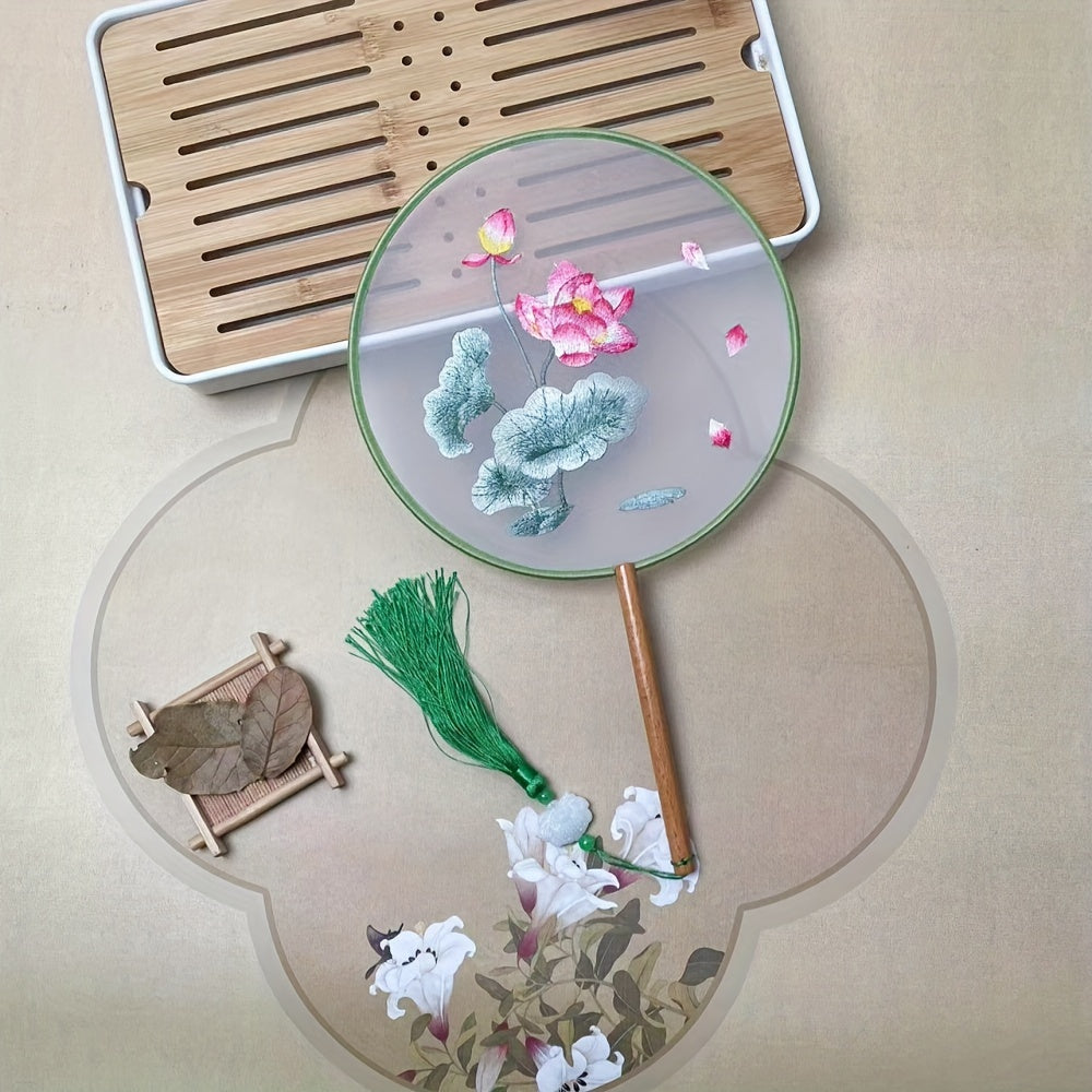 Beautifully crafted Chinese style silk embroidered fan with decorative tassel flower, perfect for use at home, while traveling, in school, or in the office.