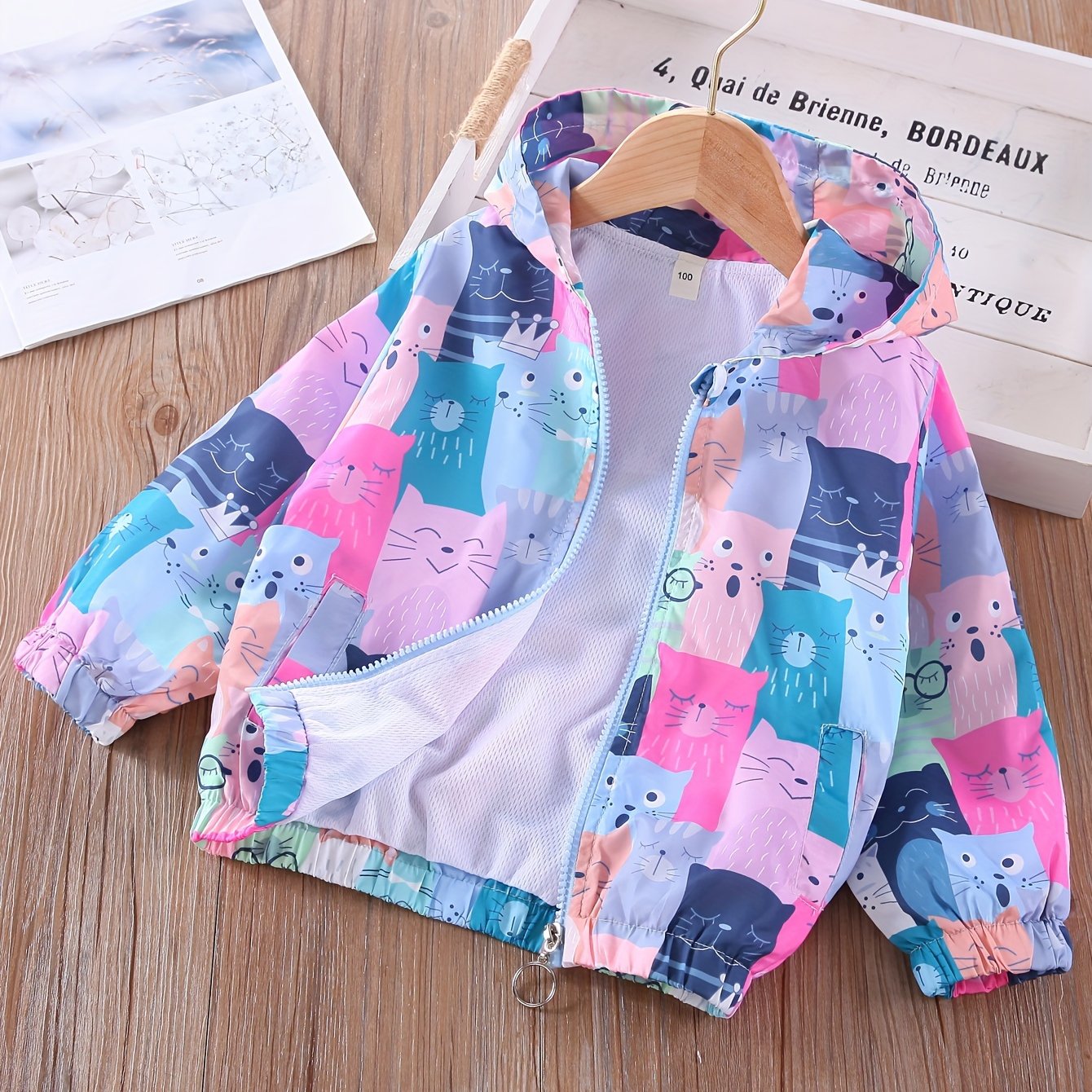 Women's lightweight windbreaker with colorful cat print, perfect for spring and fall outdoor activities.