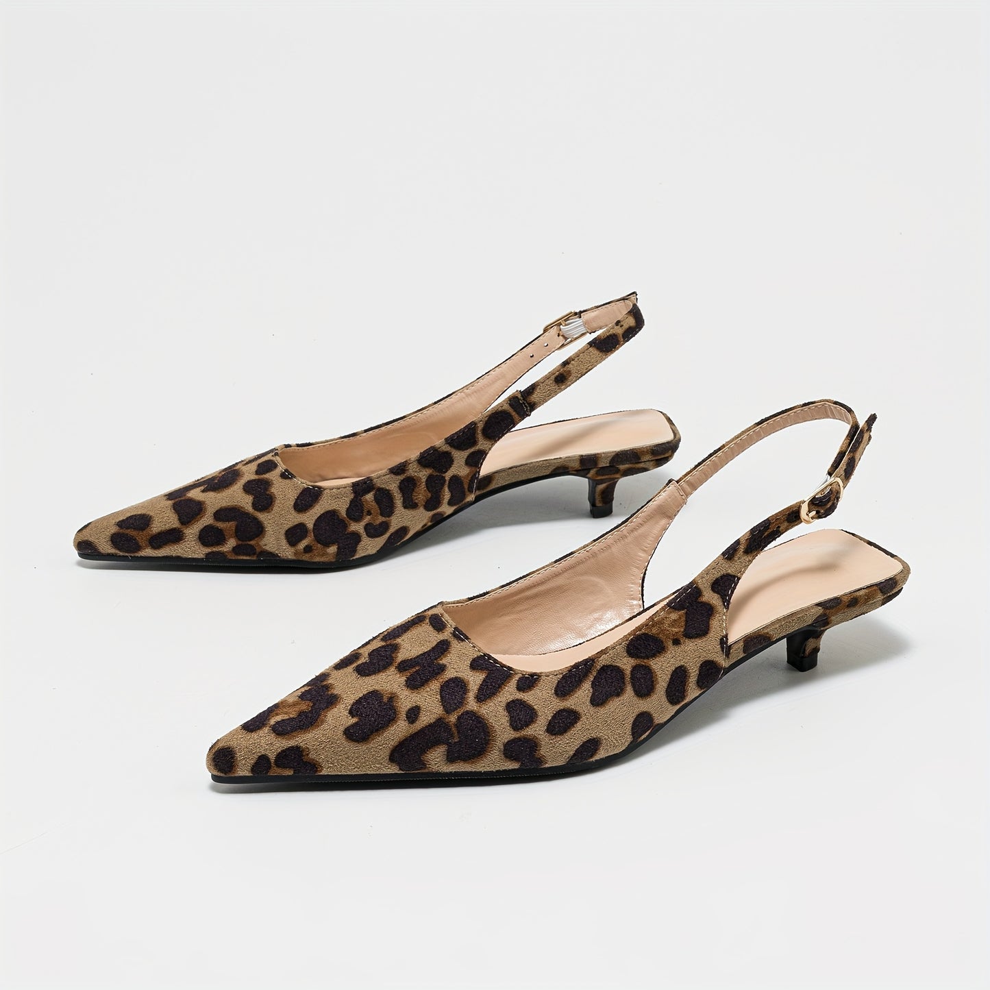 Leopard print pointed-toe mules with low chunky heel, perfect for casual or dressy outfits in summer.