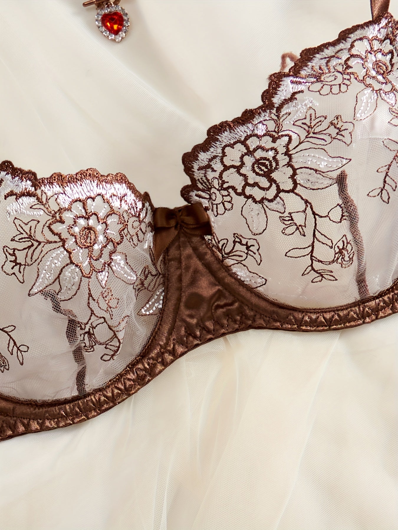 Floral embroidered satin lingerie set including plunge bra and thong, for sexy women's underwear.