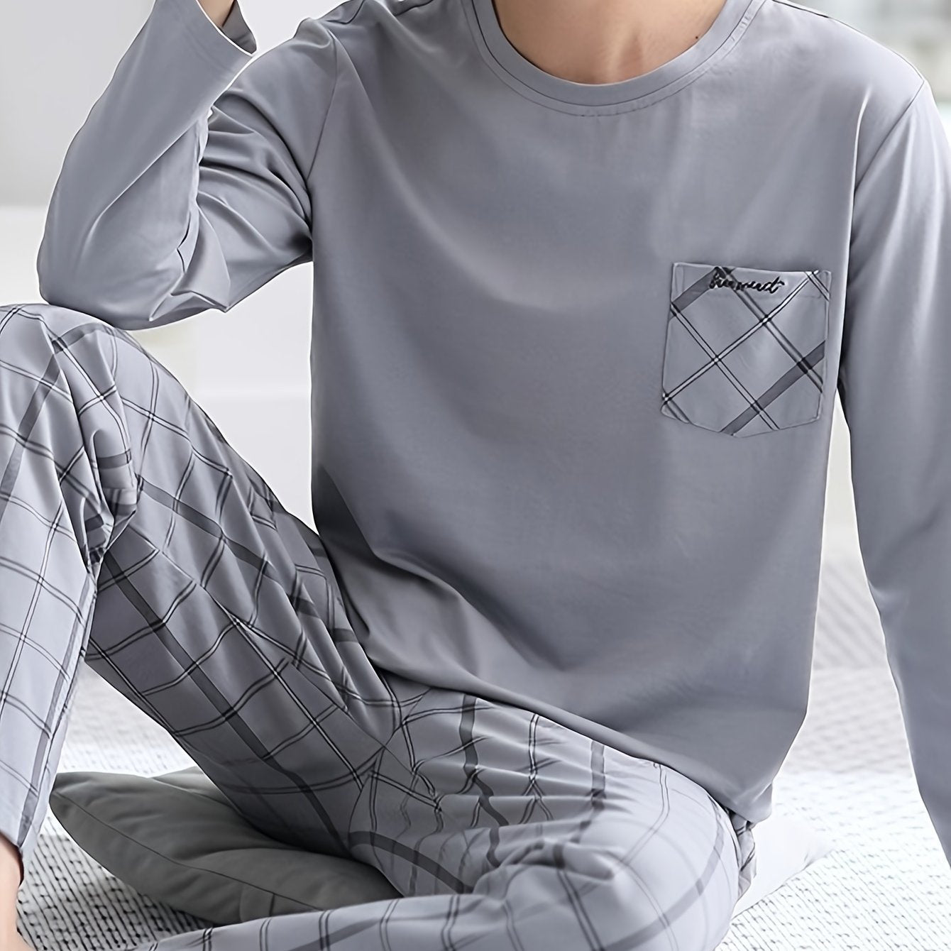 QIANNIANMA men's casual pajama set features a long-sleeve, round neck top and plaid pants with pockets. Made from a stretch polyester blend, it is machine washable and perfect for