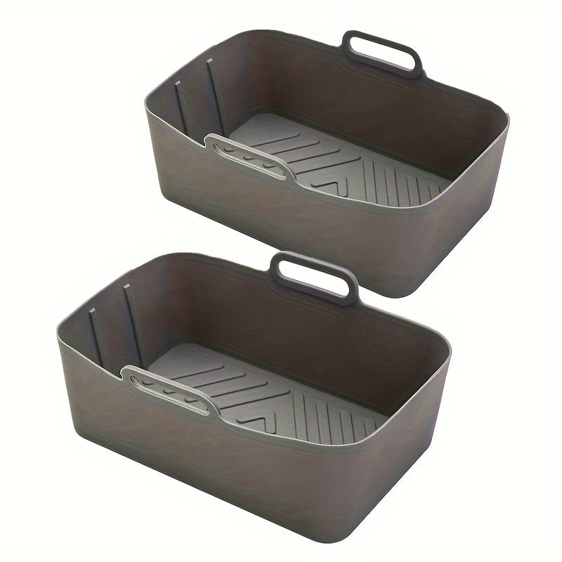 Two food-grade silicone air fryer liner trays, rectangular oven mats for baking pans, perfect for flat bottom pots. They are easy to clean, reusable, and resistant to high temperatures. These non-stick baking pans are an essential addition to your