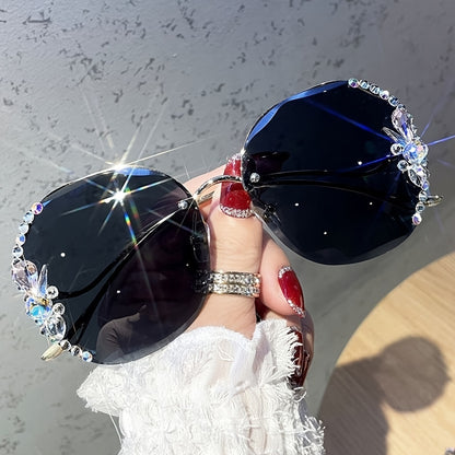 Purchase one and receive one free rhinestone glasses with a frameless gradient lens and a unique bent leg design.