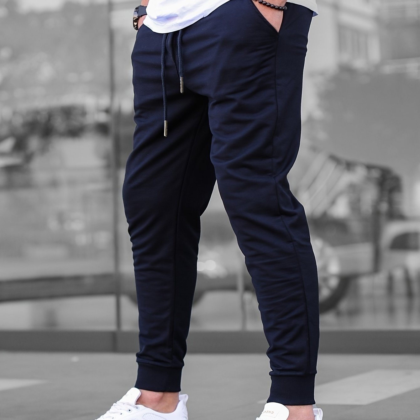 Solid color jogger pants for men with drawstrings, lightweight and breathable for running and fitness.