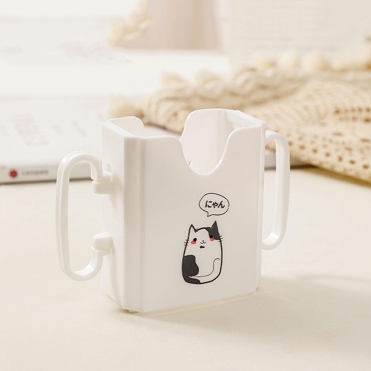 Milk carton holder featuring a cute cat design, made with spill-proof polycarbonate material. This drink support bracket is food contact safe and keeps beverages upright.