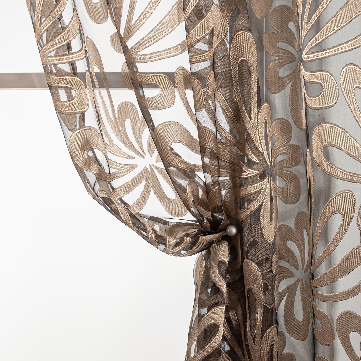 This Elegant Geometric Sheer Curtain Panel in Brown & White Floral Jacquard Design is made of lightweight polyester. It is machine washable and comes with eyelets for easy hanging. Ideal for enhancing the decor of your living room or bedroom.