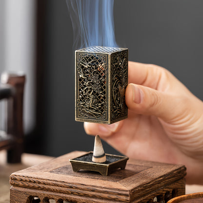 Stylish incense burner with bamboo and plum blossom design in copper/gold finish for home or office décor.