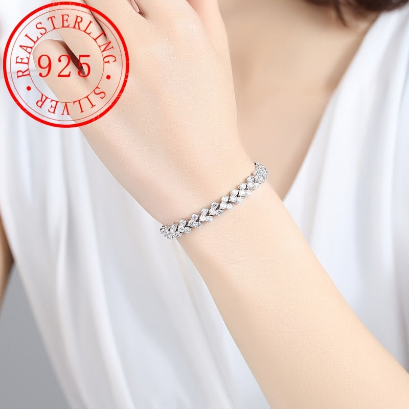 This elegant tennis bracelet is made of high-quality 925 sterling silver and features synthetic Moissanite stones. With its classic luxury design, this unisex bracelet is the perfect accessory for daily wear or gift-giving. It is also suitable for all