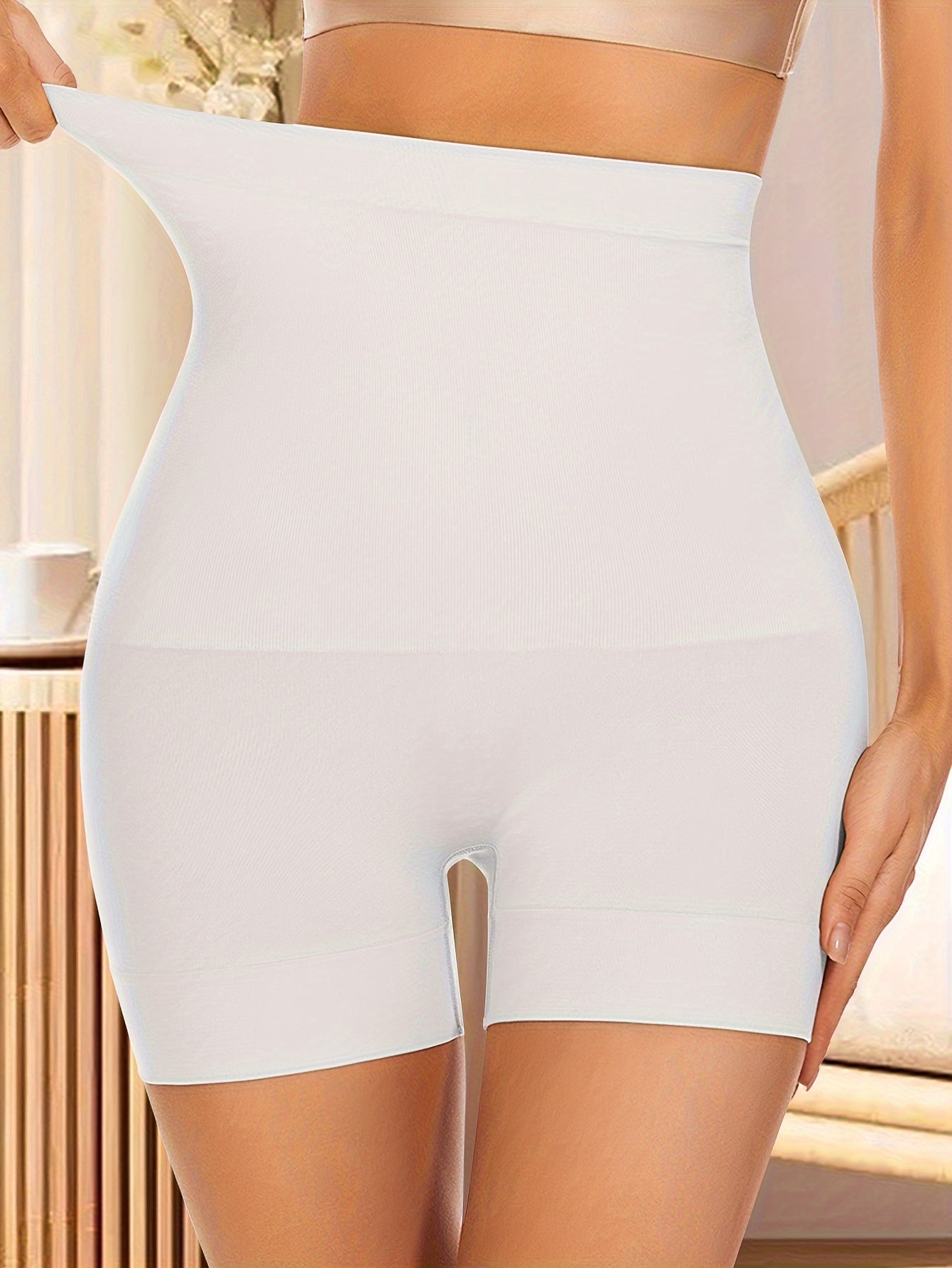 Seamless shaping high waist body shaper shorts for women.