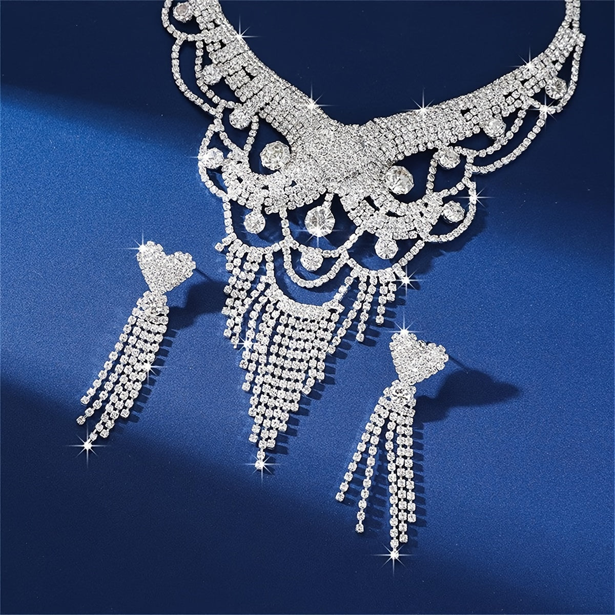 A chic and luxurious set of three tassel necklaces and matching earrings adorned with stunning rhinestones, perfect for adding a touch of glamour to any ladies' party, wedding, or as a high-end jewelry gift filled with love.