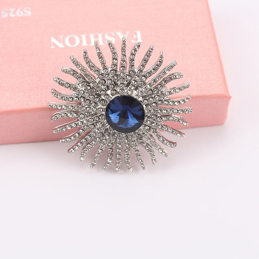 A beautiful sunflower brooch pin made of elegant alloy, adorned with sparkling rhinestones. This versatile fashion accessory is perfect for adding style to women's suits and cardigans.